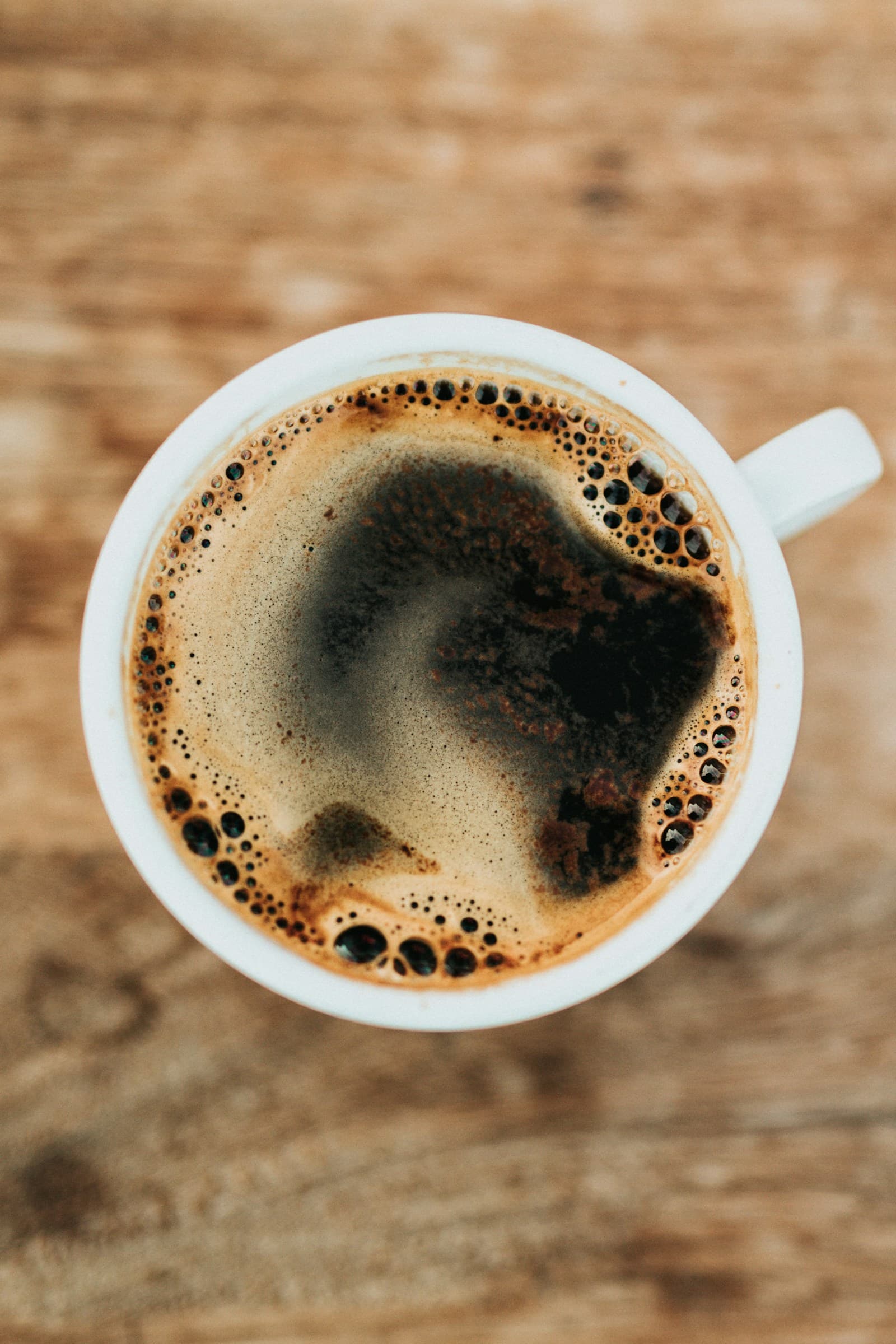 Rich espresso crema and roasted coffee beans